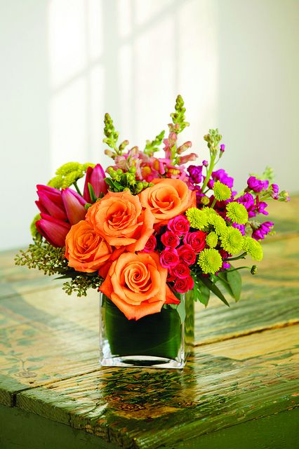 Orange roses, lime green button poms and hypericum berries, pink tulips and snapdragons, purple spray stock & a ti leaf in a cube. Healing Flowers, Winter Floral Arrangements, Flowers Pot, Sympathy Arrangements, Pot Decoration, Hot Pink Roses, Flowers Wallpapers, Sympathy Flowers, Fresh Flowers Arrangements