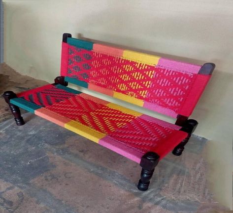 Wooden rope seater with back and colourful rope designs./ tables/ seater/ sitting /bench. If you adore colorful artifacts and furniture then this charpai is just the thing you want in your house.The chromatic shades used in the product can not just add colour but life to an ordinary corner.The ropes are handmade by artisans. Also called as Manji,Charpoy,Khaat,Khatiya,Cot,Macha etc... Legs can be dismantled,Foldable helps in consuming less space when not in use. These beautiful seater with back is made of solid Wood, It is made by the able craftsmen of Rajasthan. It can be used as stool, decoration piece etc. It is quite sturdy for sitting. Size: 120x45x90 cm. Upcycling, Charpai Decor, Charpai Bed, Woven Furniture Design, Sitting Bench, Drawing Room Decor, Chic Sofa, Woven Furniture, Wooden Wall Panels