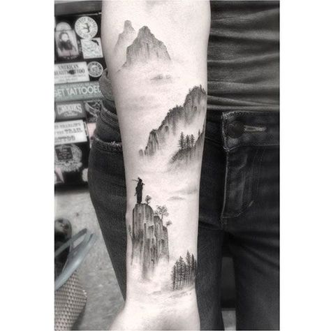 Imagine looking at your forearm and being reminded of your favorite skyline, or glancing at your wrist and being transported to Paris. Some people like to get a T-shirt with the name of a city they visited, or share photos from a particularly memorable trip; others prefer to have their memories Dr Woo Tattoo, Waterfall Tattoo, Berg Tattoo, Dr Woo, Cloud Tattoo, Gorgeous Tattoos, Mountain Tattoo, Wolf Tattoos, Feather Tattoos