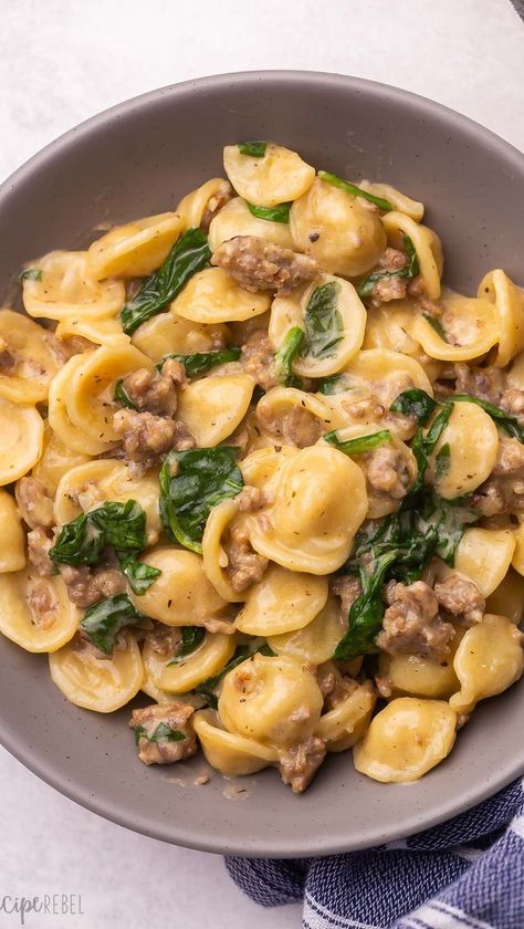 You can never have too many one pan, 30 minute meals 🎉 This Orecchiette with Sausage and spinach has a creamy sauce and LOADS of flavour. It was an instant favourite! Get the recipe at the link in my profile @thereciperebel 👈👈 https://www.thereciperebel.com/orecchiette-pasta-with-sausage/ #orecchiette #italiansausage #onepotpasta #onepotmeals #onepanmeal #pastarecipe #comfortfoods #comfortfoodie #dinnerrecipes #dinnertonight #dinnerinspiration #easyrecipes #quickmeals #f52community #thekitc Rapini Recipes, Orecchiette Pasta Recipes, Orecchiette With Sausage, Spicy Sausage Pasta, Sausage And Spinach, Spicy Italian Sausage, Frozen Pasta, Pasta With Sausage, Italian Sausage Pasta