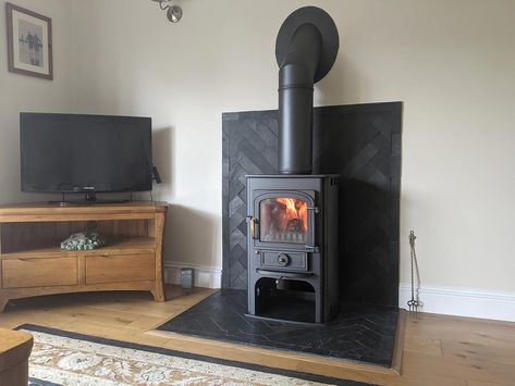 Slate Tile Wood Stove Surround, Tiling Behind Log Burner, Wood Stove Surround Corner, Stove Corner Ideas, Wood Stove Heat Shield, Earthy House, Wood Stove Surround, Woodburning Stove Fireplace, Foyer Room