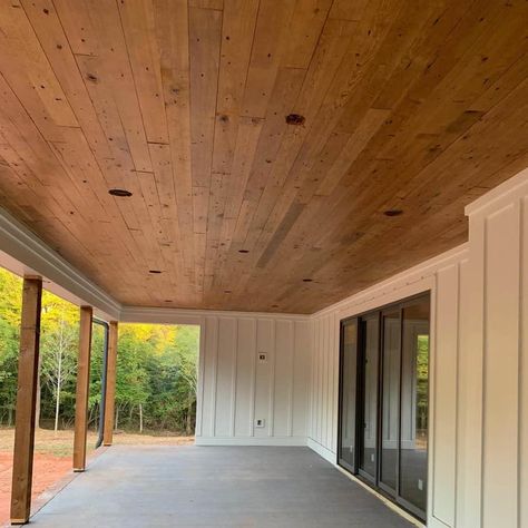 23 Porch Ceiling Ideas and Designs (with Photos) Patio With Wood Ceiling, Wooden Ceiling Outdoor Patio, Front Porch Wood Ceiling Diy, Wood Ceiling On Porch, Stained Ceiling Porch, Wooden Patio Ceiling, Car Siding Ceiling Living Rooms, Wooden Porch Ceiling, Adding A Back Porch To A House