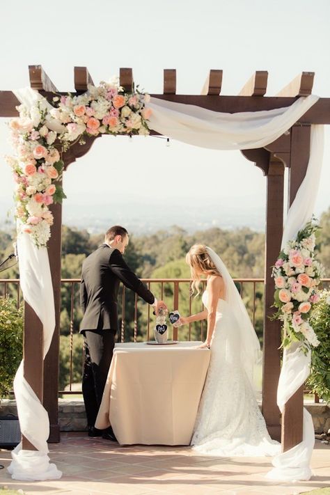 How crazy gorgeous is the floral detail on this arch? We're talking roses, peonies and so much more - made this sand ceremony even more magical! Check out the Peach Pink Palos Verdes Wedding by Figlewicz Photography here: http://www.confettidaydreams.com/peach-pink-palos-verdes-wedding/ Pergola Decor, Wedding Trellis, Wedding Pergola, Wedding Arches Outdoors, Wedding Arbors, Wedding Canopy, Wedding Ceremony Arch, Arch Decoration, Wedding Arch Flowers