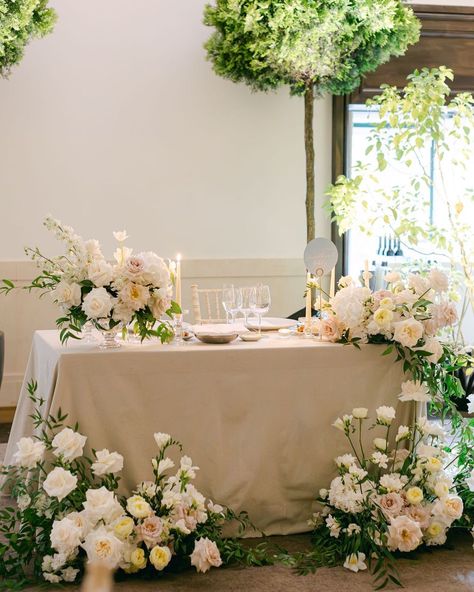 An alternative to a bridal table is a sweetheart table. This type of table will have only the bride and the groom and the immediate family and bridal party will seat elsewhere. ✨ For D&A we created a beautiful tablescape for their sweetheart table. @uniquedreamwedding @dianesoterophoto @decorelle.eu @penhalongacatering @bcplanning_rentals @inloveweddings Sweetheart Table Flowers On Floor, Diy Sweetheart Table Floral Arrangement, Flowers Behind Sweetheart Table, Wedding Reception Decorations Bride And Groom Table, Flowers For Sweetheart Table, Sweetheart Table Minimalist, Half Moon Sweetheart Table Wedding, Whimsical Sweetheart Table, Sweetheart Table Backdrop Ideas