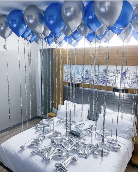 🎈Recreate this stunning birthday decoration set up with Amazon products you can get this week. Transform your hotel room with this selection of blue and silver balloons. Pro tip: For the balloon ribbons, get your DIY on and repurpose the strands from the tinsel curtain! Blue And Silver Balloon Decorations, Blue Aesthetic Birthday Decor, Blue And Silver Bday Decor, Blue And Silver Birthday Decorations, Blue Birthday Aesthetic, Blue And Silver Party Decorations, Blue And Silver Balloons, Blue Silver Balloons, Bd Gifts