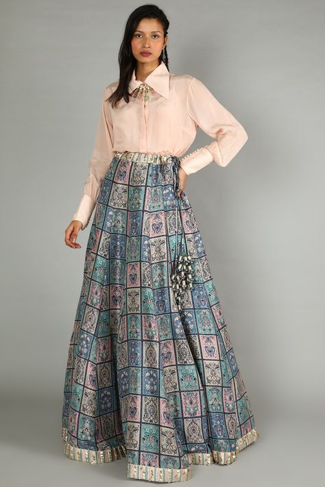 Featuring a blue and blush pink lehenga in satin silk base with galeecha patchwork print. It is paired with a matching blush pink shirt having gathered sleeves.  FIT: Fitted at bust and waist. COMPOSITION: Satin silk. CARE: Dry clean only. Shirt And Lehenga Outfit, Latest Indo Western Outfits For Women, Lehenga Blouse Designs Latest, Indo Western Outfits For Women, Pink Shirt Outfit, Satin Skirt Outfit, Wedding Outfits For Women, Simple Lehenga, Choli Dress