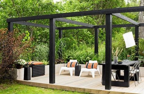 Chunky black timber pergola and lime washed deck. Pinned to Garden Design - Pergolas by Darin Bradbury.: Living Pergola, Timber Pergola, Modern Gazebo, Pergola Carport, Steel Pergola, Pergola Ideas, Pergola Lighting, Modern Pergola, Wooden Pergola