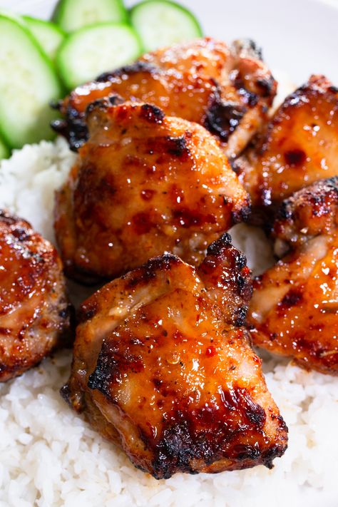 Enjoy the perfect blend of sweet and spicy with our Sticky Sweet Chili Chicken Thighs in Air Fryer recipe! Elevate your dinner game with these succulent chicken thighs, coated in a sticky and flavorful glaze. Indulge in the irresistible combination of sweet and spicy chicken, perfect for lovers of Asian-inspired cuisine. Whether you're a fan of spicy baked chicken or crave the bold flavors of spicy Korean chicken, this dish is sure to satisfy. Sweet Chili Chicken Air Fryer, Chicken Thigh Asian Recipes, Bone In Chicken Thigh Recipes Air Fryer, Air Fryer Sticky Chicken, Asian Chicken Thigh Recipes, Saucy Baked Chicken, Air Fryer Asian Chicken, Sweet Chili Chicken Thighs, Sweet And Spicy Chicken Thighs