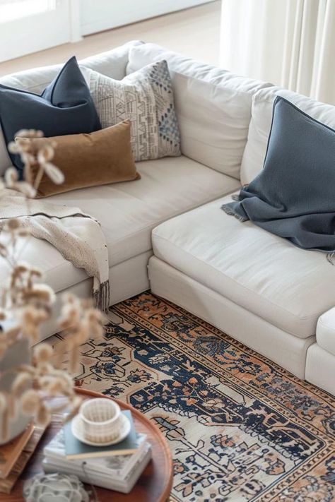 How To Place A Sectional On A Rug: Coordinated Living Space Rug Smaller Than Couch, Living Room Rug Placement With Sectional, Rug Under Sectional Sofa Layout, Couch Rug Placement, Styling Sectional Sofa, Sectional With Rug, Rug With Sectional Couch Layout, Rug Under Sectional Sofa, Sectional In Front Of Window