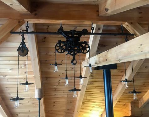 Hay Trolley light with rail. Hay Trolley, Wine Bottle Chandelier, Bottle Chandelier, Ranch Decor, Rustic Pendant Lighting, Rustic Lighting, Pole Barn, Painting Cabinets, Handmade Home Decor