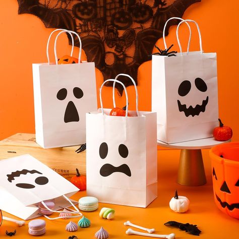 These Halloween treat bags are suitable to store candies, chocolates, cookies, biscuits, small toys, and more, fitting for Halloween parties, trick or treat events, and more. the paper bags are designed with classic ghost expression patterns, spooky and scary, creating a strong Halloween festive atmosphere. there are 24 pieces of Halloween gift bags in 3 different designs, 8 pieces per design. Halloween Party Candy Bag Ideas, Halloween Sweet Bags Ideas, Halloween Diy Goodie Bags, Ghost Bags Diy, Homemade Halloween Treat Bags, Halloween Party Bags For Kids, Halloween Treats Bags For Kids, Halloween Paper Bag Decorating Ideas, Halloween Party Treat Bags