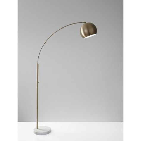 With a slim arched arm and a large dome-shaped metal shade, this lamp is a great way to achieve overhead lighting with style. A 150 Watt bulb can illuminate a large sitting area while a brushed steel finish and chunky white marble base complement the decor of any room. A rotary dimmer switch is located on the pole adjusting from bright light to mood lighting. This lamp has a clear cord and is smart outlet compatible. The bulb is not included. Torch Floor Lamp, Silver Floor Lamp, Lamp Antique, Floor Lamp With Shelves, Arched Floor Lamp, Arc Lamp, Reading Lamp Floor, Arm Floor Lamp, Metal Floor Lamps