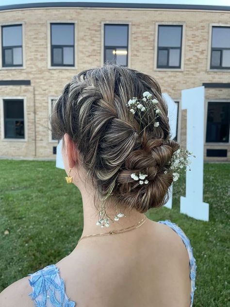 Messy Low Bun Hairstyles Prom, Formal Hairstyles Flowers, Prom Hair Updo With Braid, Braided Bun For Prom, Prom Hairstyles French Braid, Grad Updo Hairstyles, Low Bun Hairstyles With Flowers, French Braid Prom Hair, Flowers In Bun Hairstyles