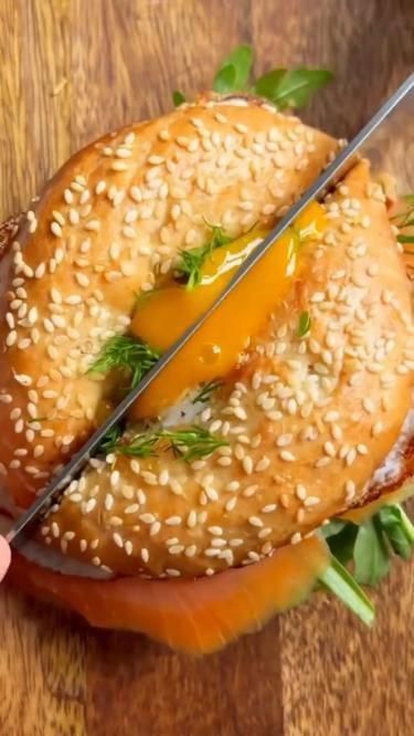 bagel sandwich that is specifically designed for breakfast, with ingredients such as eggs, bacon, cheese, and vegetables. The bagel itself may be toasted and seasoned with various spices and herbs to enhance its flavor. #recipe #foodie #healthy #easyrecipes #quickrecipes #dinnerideas #mealprep #vegetarian #vegan #glutenfree #paleo #lowcarb #dessert #appetizer #slowcooker #instantpot #mealplanning #budgetmeals #comfortfood #brunch Sandwich Bagel, Healthy Bagel, Bio On Instagram, Bagel Breakfast Sandwich, Bagel Toppings, Salmon Bagel, Breakfast Bagel, Bagel Sandwich, Mobile Website