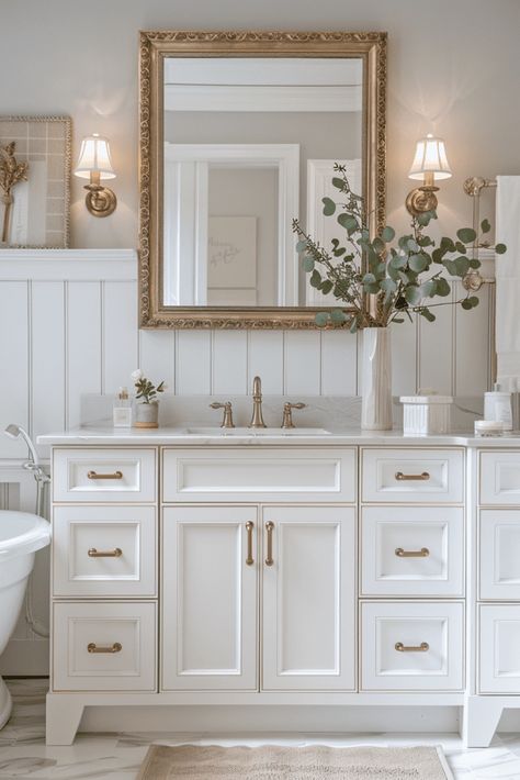 Small Bathroom Gold Mirror, Modern Vintage Bathroom Mirrors, White And Gold Half Bath, Neutral Gold Bathroom, Antique Bathroom Mirror, Warm Neutral Bathroom Ideas, Modern Antique Decor, Modern Bathroom Mirror Ideas, Gold Hardware Bathroom