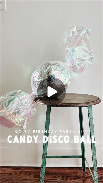 Jessica Garvin on Instagram: "Interrupting holiday content to share this easy & affordable birthday gift idea (although I suppose Santa could totally bring this too!!). My girls give these as gifts to their friends all year round! Wrap an 8 or 12 inch disco ball in iridescent paper & twist the ends to make it look like a jumbo piece of candy! 🍬🪩🍬 Always a show stopper & almost too pretty to unwrap!! Links to disco ball & wrapping paper at the link in my bio!" Disco Ball Gift Wrap, Jessica Garvin, Candy Christmas, Disco Balls, 10th Birthday, Disco Ball, Christmas Candy, Wrapping Paper, My Girl