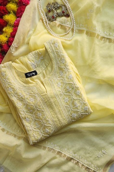 Nibs Tog Yellow Roohani Mulmul Chikankari Kurta Dupatta Set (Customizable) Step into the magic of Lemon Yellow Mulmul Chikankari Kurta with Dupatta Set. Immerse yourself in: Inspiration:  Crafted with inspiration from traditional elegance and modern trends. Creation Process:  Meticulously hand-dyed, embroidered, and adorned with pearls for a unique touch. Versatile Use:  Perfect for festivals, weddings, Haldi ceremonies, and special occasions. Benefits: -Comfortable and soft fabric -Customizable to express your style -Handcrafted for a unique touch -Embellished with Pearls detailing -Kurta Length: 50 Inches(Can be altered) Customization Options: Option 1: Semi Stitched Kurta+ Dupatta Option 2: Stitched Kurta + Dupatta Option 3: Stitched Kurta+ Dupatta+ Leggings(Soft Lycra fabric Ankle leng Chikankari Kurta Set With Dupatta, Esty Shop.com Clothes, Lemon Yellow Kurti, Yellow Chikankari Suit, Chikankari Kurta With Dupatta, Yellow Chikankari Kurta, Yellow Churidar, Mulmul Kurta, Chikankari Kurta Set