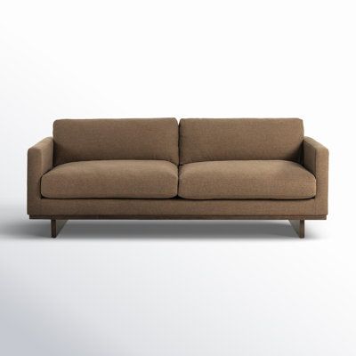 This sofa puts a contemporary twist on a classic design. It's made with a solid wood frame that rests on two wooden, rectangular legs in a natural brown hue. This beige couch is upholstered in a polyester blend, and its foam-and synthetic fiber-filled cushions offer just the right amount of padding. We love how the square arms lend this sofa a modern feel. Plus, the seat and back cushions are removable, so it's a breeze to find that lost remote. AllModern Leg Color: Dark Brown Wood, Upholstery C Brown Velvet Couch, Beige Couch, Square Arm Sofa, Natural Brown, Brown Wood, Synthetic Fiber, Classic Design, Dark Brown, Wood Frame