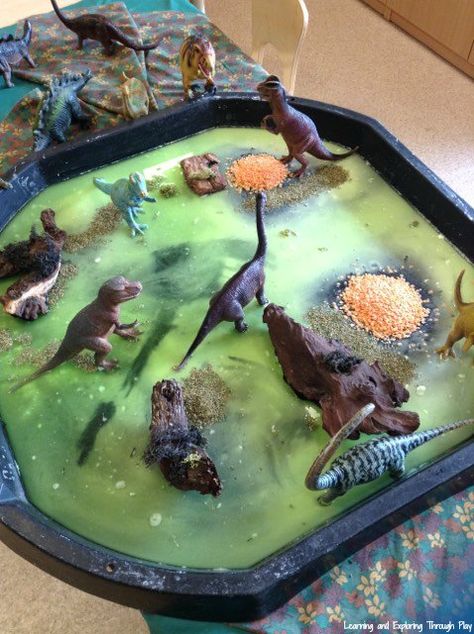 Dinosaur Sensory Swamp Tuff Tray Tuff Tray Dinosaurs, Swamp Sensory Bin, Animal Tuff Tray Ideas Eyfs, Tuff Tray Ideas For Under 2s, Tuff Tray Sensory Ideas, Animal Tuff Tray Ideas, Animal Tuff Tray, Baby Tuff Tray Ideas, Nursery Tuff Tray Ideas