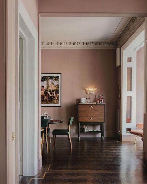 The walls could be described as dusty but I’m going to christen them ‘muddy pink’ instead | a glorious choice with those chocolatey timber floors and moody natural light | via @sheerluxe Mauve Dining Room, Tan Living Room, Fabric Covered Walls, Best Paint, Interior Design Advice, Time After Time, Best Paint Colors, Dining Room Inspiration, Color Pairing