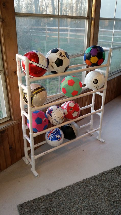 Soccer/basketball rack. Ball Storage Playroom, Pvc Pipe Projects, Garage Organization Diy, Pvc Projects, Ball Storage, Luge, Ideas Hogar, Sports Room, Backyard Projects