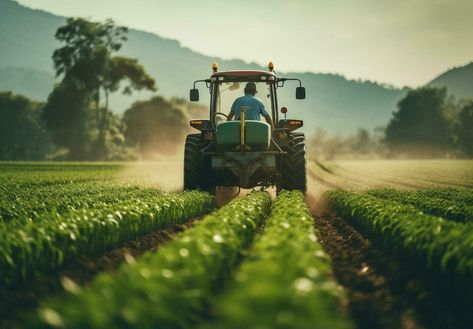 Agricultural tractor with attachments drives through farm field and agricultural background Agriculture Background Design, Organic Farming Photography, Farming Images, Farming Photo, Tractor Photography, Agriculture Pictures, Farm Background, Farming Land, Agriculture Background