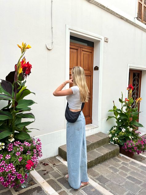 maxi denim skirt, grey top, uniqlo bag, italian architecture, plants, flowers Denim Skirt Outfit Fall 2024, Uniqlo Round Mini Shoulder Bag Outfit, Uniqlo Dumpling Bag Outfit, Uniqlo Moon Bag Outfit, Uniqlo Bag Outfit, Mini Shoulder Bag Outfit, Dumpling Bag Outfit, Lisbon Outfit, Roadtrip Outfit