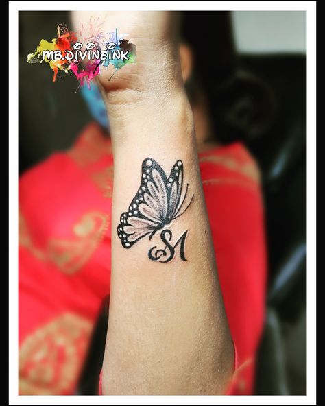 Initial tattoo, SM Initial tattoo, alphabet tattoo, butterfly tattoo, tattoo for couples, black tattoo, wrist tattoo, beautiful tattoo, tattoo for women, tattoo for men, tattoo love, creative tattoo INSTAGRAM: www.instagram.com/mb.divineink Butterfly And Initial Tattoo, Sm Tattoo Letter Design, Butterfly With Initials Tattoo, Butterfly With Letter Tattoo, Butterfly Initial Tattoo, Butterfly Tattoo With Initials, Butterfly With Name Tattoo, S Butterfly Tattoo, Sm Tattoo