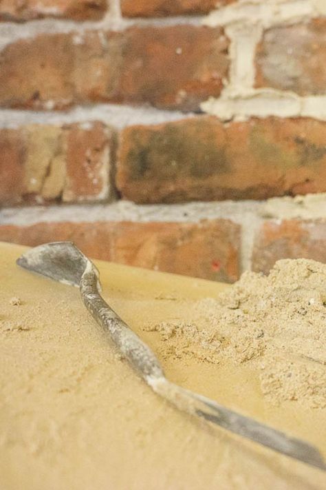 Lime mortar and a pointing trowel with a freshly pointed brick wall. Lime Mortar, Stone Masonry, Carving Fork, Brickwork, Written By, Stone