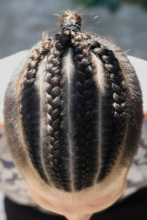 Four Cornrow Braids #undercut #manbraid #manbun #braidsformen #cornrows Want to try on man bun braids and looking for some inspiration? In our gallery, you'll find the most elaborate design ideas that suit everyone, from white to black men. Choose the style that matches your tastes and preferences, be it a short hair braided top knot or undercut cornrow bun. #menshaircuts #menshairstyles Undercut Braids, Trendy Cornrows, Man Bun Braids, Mens Ponytail Hairstyles, Cornrows Men, Long Undercut, Braids With Fade, Bun Braids, Braided Man Bun