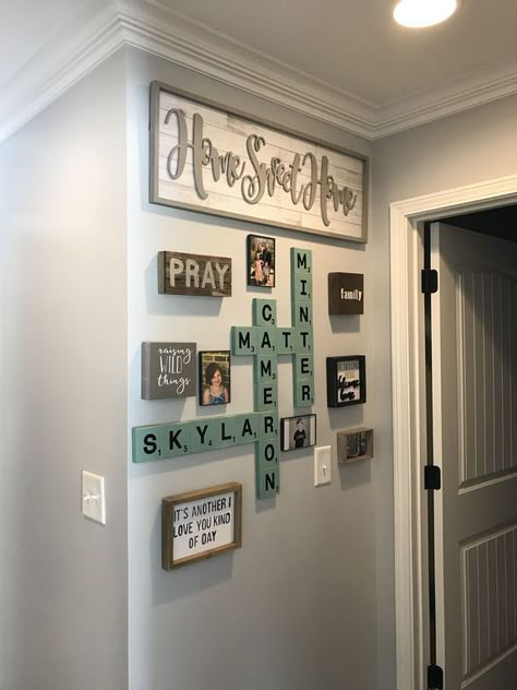 Scrabble Wall Art Farmhouse, Wall Behind Master Bed Decorating Ideas, Decor Around Door Frame, Wall Decor Going Down Stairs To Basement, Scrabble Wall Art Ideas, Scrabble Wall Art Diy, Wall Decor Arrangements, Scrabble Wall Decor, Basement Stair