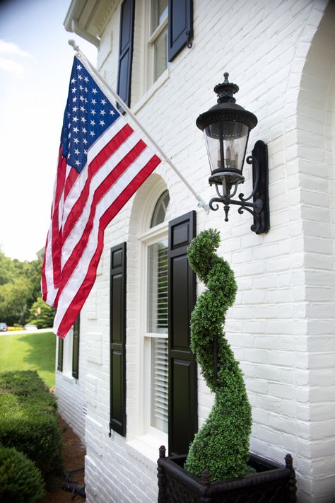 american flag American Flag Home Exterior, American Flag House Exterior, American Flag In Front Of House, American Flag Outside House, Patriotic House Exterior, American Flag On House Exterior, American Flag On House, Flag On Porch, Flag On House