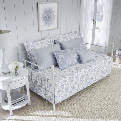 The daybed set combines modern elegance with timeless style. Constructed with quality cotton, the daybed, and standard shams feature a blue floral design on the classic white ground, while the included coordinating bolster pillow cover can be used as a comfy backrest. This versatile daybed set fits any décor and can be used in a bedroom, living room, or home office. The daybed set is filled with a cotton/polyester blend and is lightweight, ideal for year-round use. The set includes one daybed co Laura Ashley Sheets, Daybed Bedding Sets, Blue Daybed, Laura Ashley Bedding, Daybed Cover Sets, Daybed Sets, Daybed Bedding, Laura Ashley Home, Daybed Covers