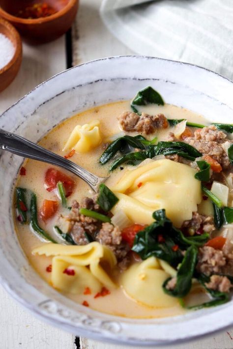 Spicy Italian sausage, tender baby spinach, and fluffy tortellini come together for one delicious bowl of goodness. Spinach and Tortellini soup is going to become your go to winter staple.Another day, another cozy bowl of soup.At this rate, I should think about changing my blog name to Soup Thyme. I’m kidding– but only slightly!This soup Michael has deemed “Pizza Soup.” I’m not sure on the name– but it does have all of the flavors there. Italian sausage, cheese, tomatoes, all in a garl… Spinach And Tortellini, Chicken Corn Chowder Recipe, Sausage Tortellini Soup, Chicken Corn Chowder, Sausage Tortellini, Corn Chowder Recipe, Mild Italian Sausage, Dutch Oven Recipes, Tortellini Soup