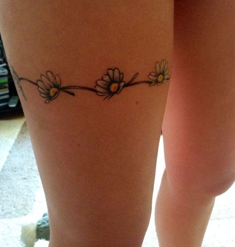 Pure and innocent — that's how people imagine chamomile, and this is one of its main meanings. But there are others. What are they? Read our article. Bonus: 60 cool daisy tattoo ideas you'll love. Daisy Chain Tattoo Ankle, Chain Tattoos, Daisy Chain Tattoo, Tattoos Leg, Daisy Tattoo Designs, Flowers Tattoos, Garter Tattoo, Chain Tattoo, Flower Thigh Tattoos