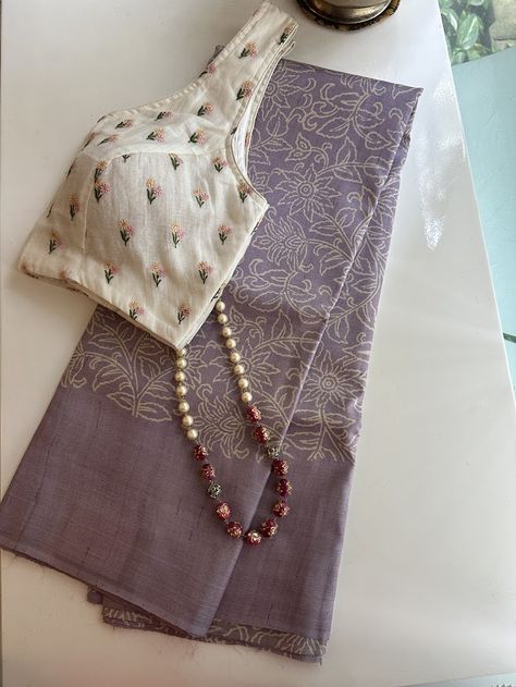 This Veena sees the coming together of an ethereal textile in a sublime colour palette and classy design. A lavendar pure handwoven tussar saree with beige hand block printed florals all of the body and vertical creeper type block prints on the pallu , is as dreamy and sophisticated of a saree that you are going to lay your eyes on. Hand Printed Sarees, Cotton Fabrics Textiles, Textile Designing, Tussar Saree, Saree Blouse Styles, Cotton Saree Blouse Designs, Cotton Saree Blouse, Simple Saree Designs, Latest Blouse Designs Pattern