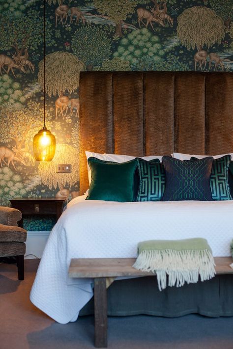 Jewel tones are perfect if you are looking to create a cosy, sumptuous space in which to feel pampered. This wonderful Brook Wallpaper by William Morris provides you with the ideal colour pallet. Here's the ultimate stylish cosy bedrooms to copy https://www.fabricsandpapers.com/cosy-bedroom-ideas-to-copy #Bedroom #MyRoom #ForHim #Green Green Wallpaper Bedroom Feature Wall, Indian Theme Bedroom Ideas, Warm Bedroom Wallpaper, Green Bedroom Wallpaper Ideas, 1930s Bedroom Ideas, Green And Blue Bedroom Ideas, William Morris Interior, Jewel Tone Bedroom, Pattern Headboard