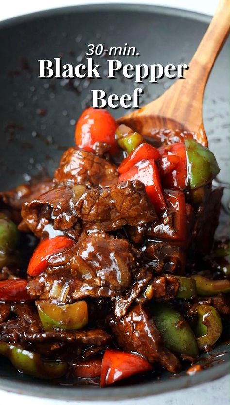 Savor the flavors of this quick and easy Black Pepper Beef dish. Juicy beef is stir-fried with vibrant green and red peppers, along with onions, all coated in a delicious black pepper sauce. Perfect for a busy weeknight, this meal comes together in just 30 minutes or less. Check out the recipe at the provided link. Peppered Beef, Chinese Pepper Steak, Black Pepper Beef, Pepper Beef, Beef Steak Recipes, Chinese Cooking Recipes, Easy Chinese Recipes, Pepper Steak, Green Peppers