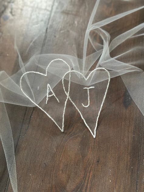 This appliqué is hand-embroidered and features initials enclosed within interlocking hearts.  The design is embroidered onto our signature super sheer SV illusion tulle which is then trimmed to the stitched edge, ready to be attached to your veil or dress. The embroidered appliqué can also be framed and given as a wedding gift.  Your appliqué will come to you with a length of super fine ivory thread which can be used to hand-stitch the design onto your garment.  The dimensions of the appliqué ar Hand Embroidered Veil, Wedding Embroidery Gifts, Wedding Veil Embroidery, Embroidery For Wedding, Veil Embroidery, Bridal Embroidery, Embroidered Veil, Wedding Portrait Poses, Iconic Weddings