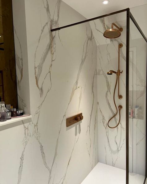 In this en-suite bathroom, you'll find bookmatched sets of our Calacatta Oro, installed by @jjupp_tiling. Thanks for choosing Clay for your project; we love the end result. We're always excited to see your completed projects or installations. Remember to tag us to be featured. Achieve the Aesthetic: Calacatta Oro MB06 Imagery sourced: @jjupp_tiling #clayinternational #calcattaoro #bookmatched #bathroominstallation #bathroomdesign #calacattaoro Calacatta Oro Bathroom, Calacatta Gold Marble Bathroom, Calacatta Oro, Bathroom Installation, Suite Bathroom, Excited To See You, En Suite Bathroom, Bathroom Design, The End