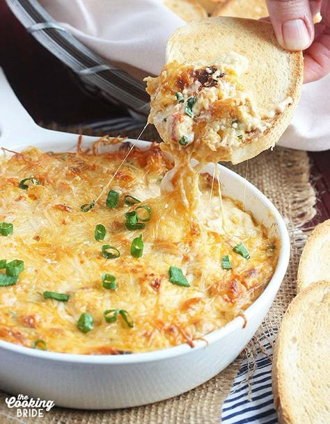 If you love crawfish, you will love this ooey, gooey hot baked crawfish dip. Tender crawfish tails are combined with cream cheese, Parmesan, green onions and garlic and served with warm bread or crackers. Crawfish Dip, Reuben Dip, Crawfish Recipes, Bacon Deviled Eggs, Cajun Dishes, Louisiana Recipes, Candied Bacon, Crawfish Boil, Creole Recipes