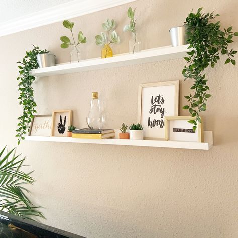 White floating shelves White Floating Shelf Decor Bedroom, Boho Floating Shelves Bedroom, Boho Shelf Ideas, White Floating Shelf Decor, Boho Floating Shelf Decor, Ikea Wall Shelves Living Room, Floating White Shelves Bedroom, Living Room Wall Decor Ideas Above Couch Floating Shelves, Bedroom Floating Shelf Decor