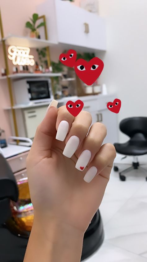 White Nails With Heart With Eyes, Heart In Corner Of Nail, All White Nails With Heart, White Nails With Orange Heart, Nails Acrylic White With Heart, White Nails With One Red Heart, White Square Nails With Heart, White Nails With One Heart, Corner Heart Nails