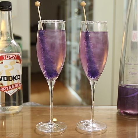 Make sure you have all the bartending tools you need to make these awesome drinks: https://www.amazon.com/shop/tipsybartender  Champagne cocktails don't get much prettier than this New Year's Purple Shimmering Champagne. This delicious 2019 New Year's Eve Champagne cocktail mixes up vodka, Purple Viniq, champagne, corn syrup, silver sugar, and Purple Rock Candy, and delivers sweet, bubbly tastiness with every sip. Vodka Mixers, Champagne Margaritas, New Year's Drinks, Champagne Recipes Cocktails, Purple Drinks, Candy Cocktails, Champagne Drinks, Purple Cocktails, Tipsy Bartender