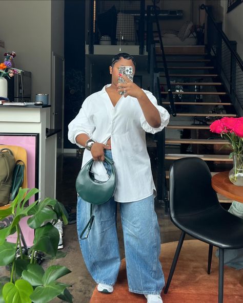 Lil Minimal Inspo 🧚🏾‍♂️🩷✨ This white button down is actually a short dress.. Keep the bottom buttons open & added some baggy barrel jeans for a lil more shape & dad sneaker. & a fun shaped bag with color (moon bag from @staud.clothing ) I also bought this silver bracelet from Zara for the renaissance concert. I’m a minimal girl at heart but I like to spice it up. White T And Jeans Outfit, Silver Bags Outfit, White Button Down With Jeans, Button Up Over Dress, Baggy White Button Up Shirt Outfit, Baggy Jeans Button Up Shirt, White Button Up Outfits, Denim White Outfit, White Long Sleeve Top Outfit