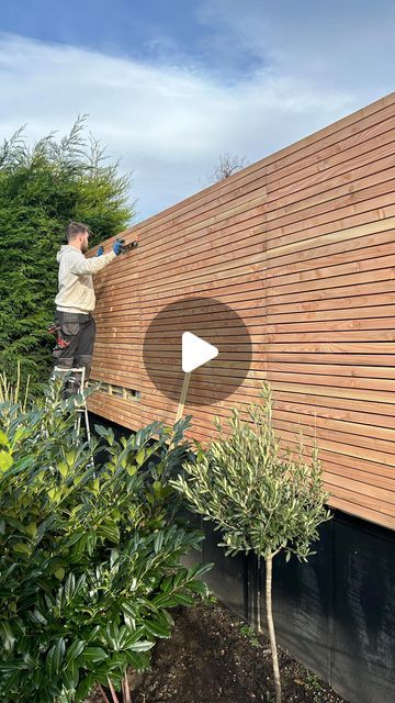 Kerry Kellett on Instagram: "Hello beautiful larch slat fencing ✨🤍  I painted the garden fencing last year, it took me absolutely ages and I wasn’t thrilled with the end result. The dream was always to have a slatted fence, but we knew it would be a massive job.  These slatted fence panels from @ruby.ltd are amazing. They come in loads of different sizes and you can even have them custom-made. We chose to have a seamless look across the whole fence, but you can also slot them in between your concrete fence post.   More details in my highlight ✨  AD  #gardening #garden #gardens #gardendesign #fencing #gardenfence #gardenfencing #gardenfenceideas #slattedfence #larchfencing #gardeninspiration" Painted Concrete Fence Posts, Wooden Slat Fence, Garden Fence Panels Ideas, Garden Slat Wall, Slatted Fence Ideas, Slated Fence Ideas, Slat Fence Vertical, Outdoor Fence Painting Ideas, Baton Fencing