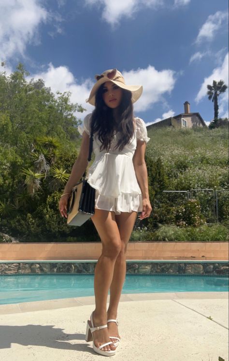 #ootd #casualoutfit #dress #whitedress #whiteheels #heels #pretty #romper #whiteromper #outfitoftheday #summerdress #springfashion #summerfashion #cute #adorable #aesthetic #feminine #girly #softgirl #whiteoutfit #elegant #summertime #opentoeheel #fashion #trendy #sunhat #heartshapedsunglasses #purse Sunhat Outfit, Arch Nemesis, Adorable Aesthetic, Aesthetic Feminine, Heart Shaped Sunglasses, White Romper, White Heels, Outfits With Hats, Grad Party