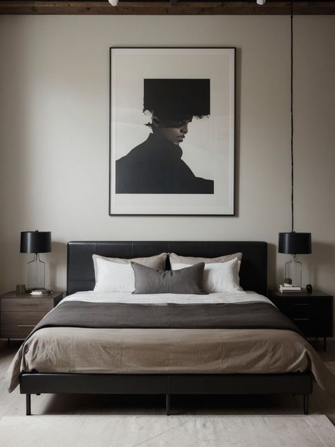 Hang a large, bold art piece above the bed for a masculine touch. Incorporate sleek and minimalist furniture such as a leather chair and industrial-style nightstand for a modern look. Masculine Decor Apartment, Modern Masculine Bedroom, Masculine Bed, Masculine Apartment, Masculine Bedroom Design, Masculine Decor, Masculine Bedroom, Style Nightstand, Bed Design Modern