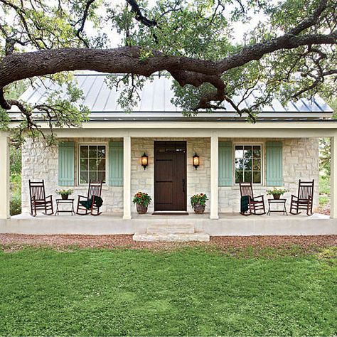 This casual Hill Country cottage pours on the Southern charm with its familiar farmhouse form, picture-perfect proportions, and inviting front porch nestled beneath a curtain of large oak trees. The stone facade and metal roofing nod back to Fredericksburg's original German-style architecture. We'd love to kick up our feet and wind down our week in this soulful country home. Texas Farmhouse, Farmhouse Front Porches, Stone Facade, Small Farmhouse, Farmhouse Front, Farmhouse Cottage, Rocking Chairs, Cottage Design, The Porch