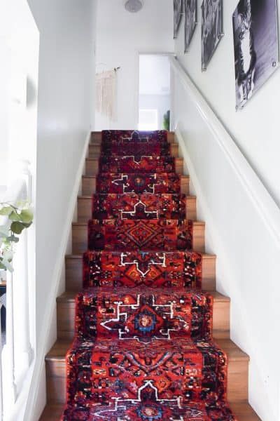 How to install a stair runner? Look no further! I will share how we installed out extra long runner rug on stairs in this post. Read on! Rug On Staircase, Narrow Stairwell Decor, Split Level Entryway Wallpaper, Stair And Hallway Runner, Stairwell Addition, Stair Runner Rug, Rug On Stairs, Green Stair Runner, Rug Runner Stairs